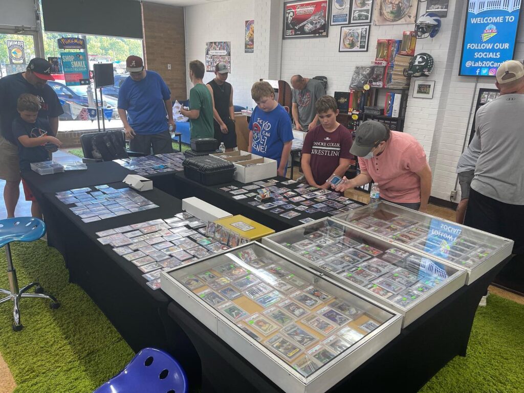 Customers looking at sports paraphernalia at Lab 20 Sports Cards.